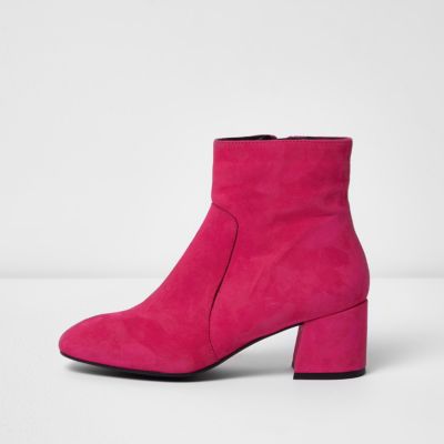 Bright pink suede block heel ankle boots